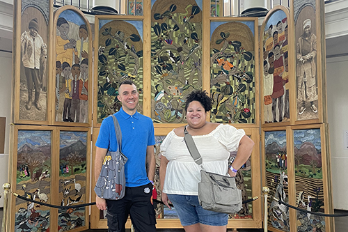 Yale Ph.D. candidates Alex Fialho and Alexandra “Aly” Thomas in front of the Keiskamma Art Project’s Creation Altarpiece (2007) at Constitution Hill, Johannesburg in January 2023